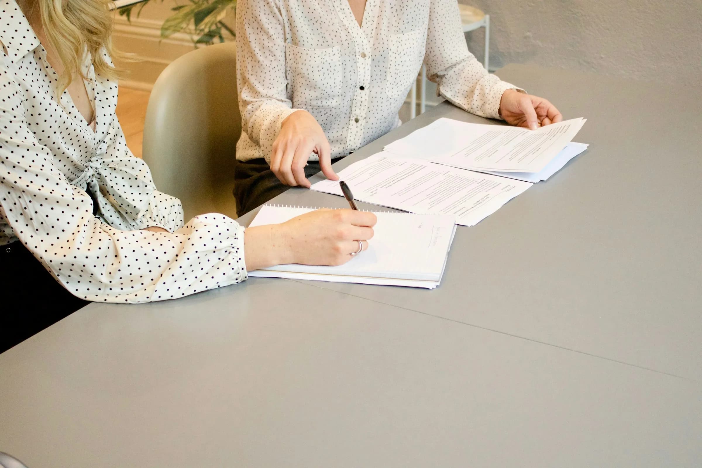 Quality professionals reviewing and signing documents